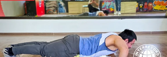 The most push-ups on the backs of hands in one minute