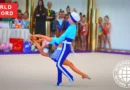 sibling duo performing rhythmic gymnastics routine