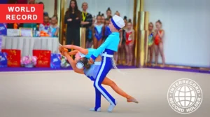 sibling duo performing rhythmic gymnastics routine