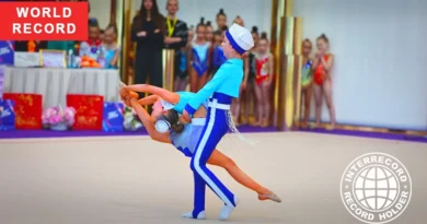 sibling duo performing rhythmic gymnastics routine