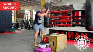 Dmitry Russkikh jumps onto sadhu board during nail fitness record