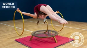 World Record in Teeth Grip Stand with Dual Hoop Rotation