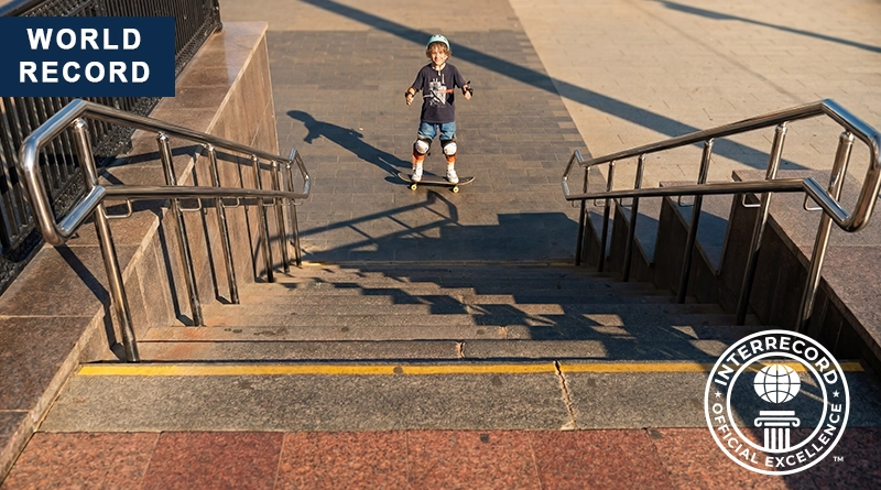 The youngest age for performing an ollie down a 13-step stair set on a skateboard